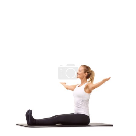 Photo for Embrace fitness. A delighted young woman working out on her exercise mat while isolated on a white background - Royalty Free Image
