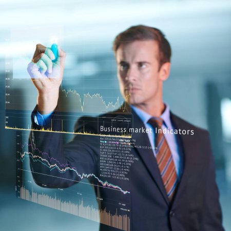 Photo for Taking business into the future. a handsome young businessman using a digital interface - Royalty Free Image