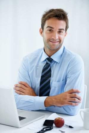 Photo for The modern professional. a handsome young businessman at work - Royalty Free Image