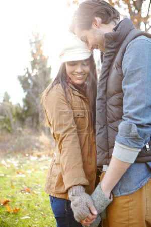 Photo for Tender love. A loving young couple standing together outdoors in the woods - Royalty Free Image