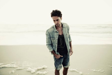Photo for Theres no better place to relax. a handsome young man on the beach - Royalty Free Image