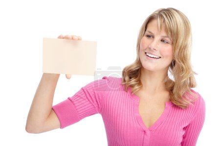 Photo for Impressive copyspace. A pretty young woman holding a blank card while isolated on a white background - Royalty Free Image