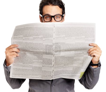 Photo for Hes got the inside track. A young businessman covering his face with a newspaper - isolated - Royalty Free Image