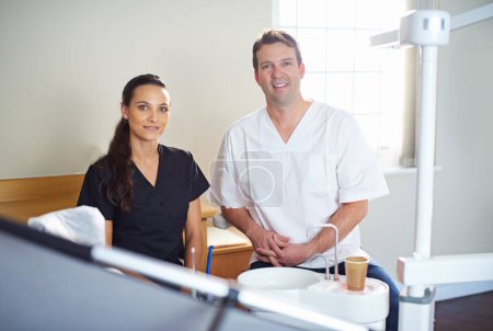 Photo for Youre in very capable hands. Cropped portrait of a dentist standing with his assistant - Royalty Free Image