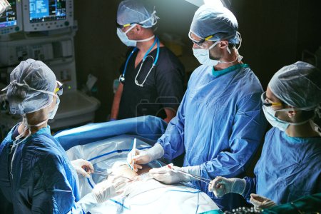 Photo for Saving lives is the job description. surgeons in an operating room - Royalty Free Image