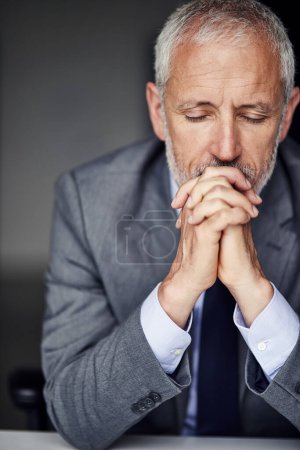 Photo for Taking a minute to think. a mature businessman looking pensive in his office - Royalty Free Image