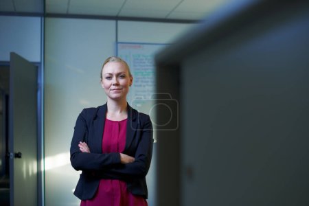 Photo for This office is my domain. Portrait of an attractive businesswoman standing with her arms crossed in the office - Royalty Free Image