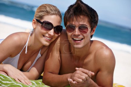 Photo for Summers here. a happy young couple enjoying a summers day at the beach - Royalty Free Image