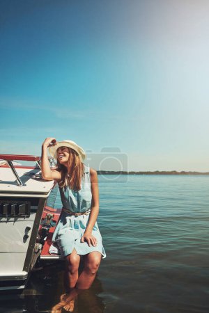 Photo for Unwind in the sunshine. an attractive young woman spending the day on her private yacht - Royalty Free Image