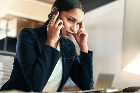 Photo for This call is stressing me out. a young businesswoman experiencing a headache at work - Royalty Free Image