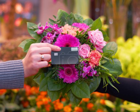 Photo for Florist, flowers and hand of woman with credit card for payment, tap and floral purchase. Closeup of flower, bouquet and customer shopping for fresh and roses at a nursery with debit card for billing. - Royalty Free Image