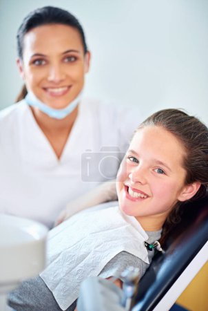 Photo for Another perfect smile. a female dentist and child in a dentist office - Royalty Free Image