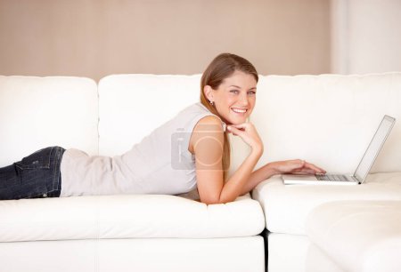 Photo for Smile, laptop and portrait of woman sofa in living room for social media, streaming and website. Search, technology and digital with female user typing at home for connection, email and internet. - Royalty Free Image
