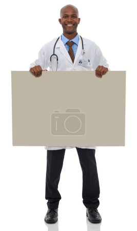 Photo for Endorsing your healthcare message. A young male doctor holding up a blank board - Royalty Free Image