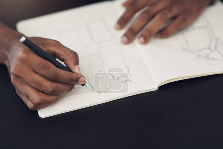 Photo for Translating his designs onto paper. Closeup shot of an unrecognisable designer sketching in a notebook in an office - Royalty Free Image