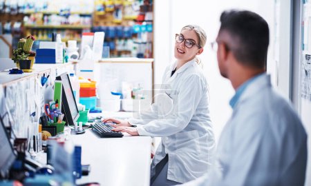 Photo for They work well alongside each other. two pharmacists working in a pharmacy - Royalty Free Image