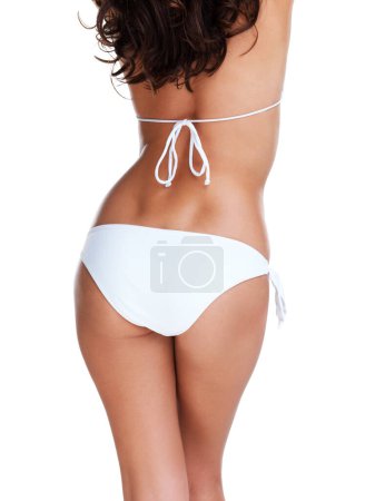 Téléchargez les photos : Woman, bikini and studio with body and behind for wellness or healthy lifestyle with weight loss goal. Slim, model and butt in swimwear with isolated white background for summer goals or beauty - en image libre de droit