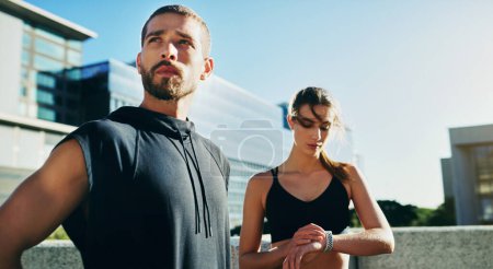 Photo for Focus fast tracks your fitness goals. a young couple going for a workout together in the city - Royalty Free Image