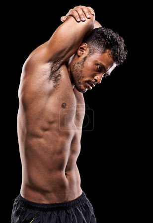Photo for Give it your all. Studio shot of a fit young man isolated on black - Royalty Free Image
