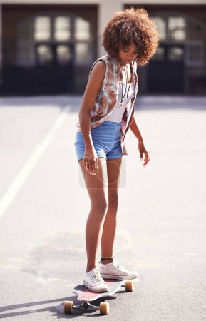 Photo for You only live once. Full length shot of a young woman on her skateboard - Royalty Free Image