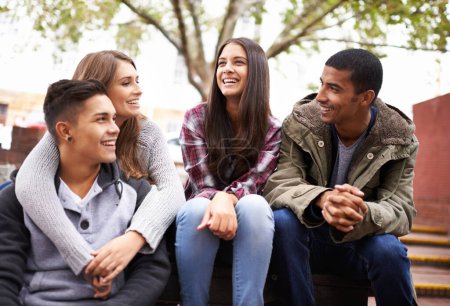 Photo for University, happy and friends on campus stairs in conversation, talking and chatting outdoors. Diversity, learning and happy men and women students smile for education on school, academy and college. - Royalty Free Image