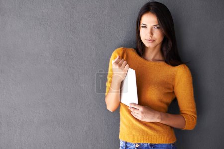 Photo for All mine...Portrait of an attractive young woman holding a digital tablet - Royalty Free Image