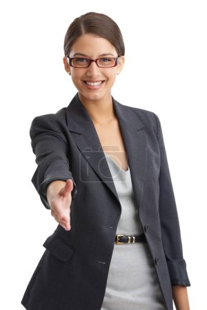 Photo for Youre going to love it here. Portrait of a businesswoman extending her hand in greeting in the studio - Royalty Free Image