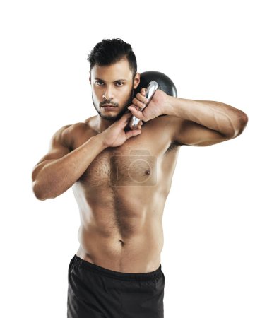 Photo for Staying in top form with weight training. Studio shot of a fit young man working out with a kettle bell against a white background - Royalty Free Image