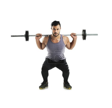 Photo for Training like a champion. Studio shot a young man working out with a barbell against a white background - Royalty Free Image