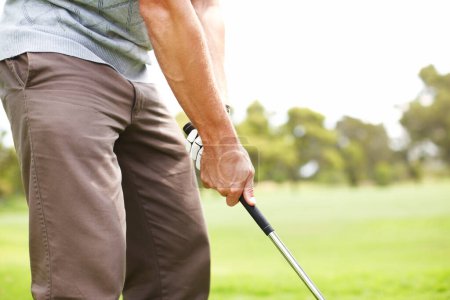 Photo for Technique and form are crucial. Cropped view of a man playing golf on the course - Royalty Free Image