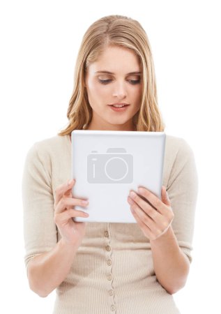 Photo for She stays connected everywhere. Studio shot of a young blonde woman holding a digital tablet isolated on white - Royalty Free Image
