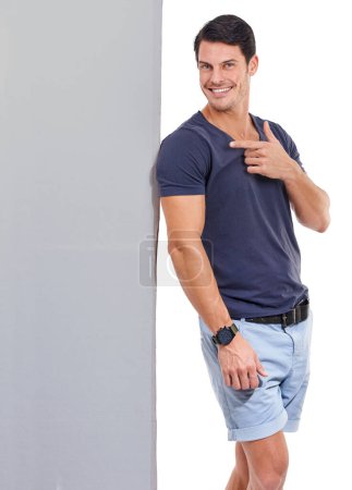 Photo for Check it out. Studio portrait of a handsome young man istanding beside a blank sign solated on white - Royalty Free Image