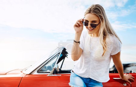 Photo for Everything I need can be found on the open road. a happy young woman enjoying a summers road trip - Royalty Free Image