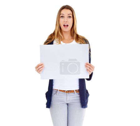 Photo for Amazing. Studio shot of a young woman carrying a blank placard isolated on white - Royalty Free Image