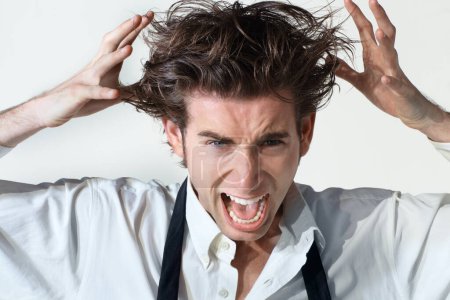 Photo for Crazy, scream and portrait of business man on white background with stress, frustrated and anger. Mental health, depression and face of male worker shouting, stressed out and messy hair in studio. - Royalty Free Image