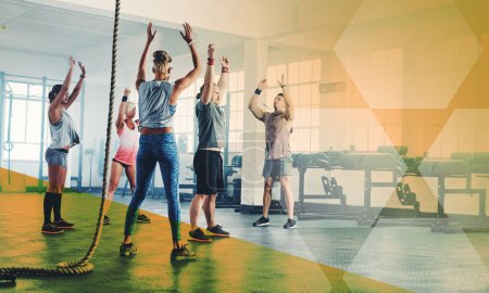 Photo for Fitness, hands up and group of people exercise, workout and training in gym class. Athlete men and women together for power challenge, commitment and stretching at a club with a mockup overlay. - Royalty Free Image