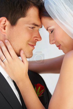 Photo for Tender love. Intimate image of a newlywed couple basking in their love - Royalty Free Image