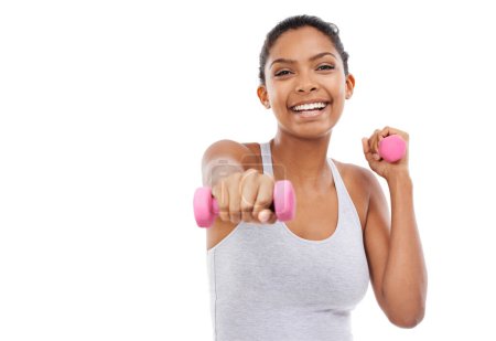 Photo for Feeling the burn and pushing through with a smile. A young woman exercising with weights - Royalty Free Image