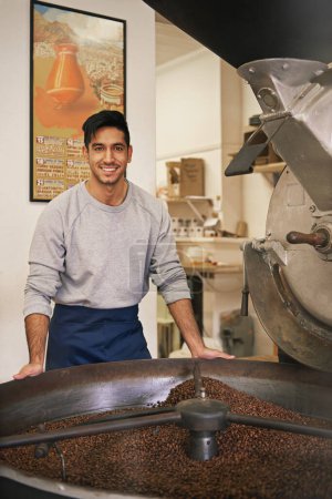 Photo for I only use the finest beans. Cropped portrait of a young man grinding and roasting coffee beans - Royalty Free Image