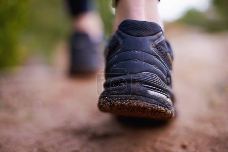 Photo for You dont have to go fast you just have to go. Closeup shot of the feet of a woman hiking a long a trail - Royalty Free Image