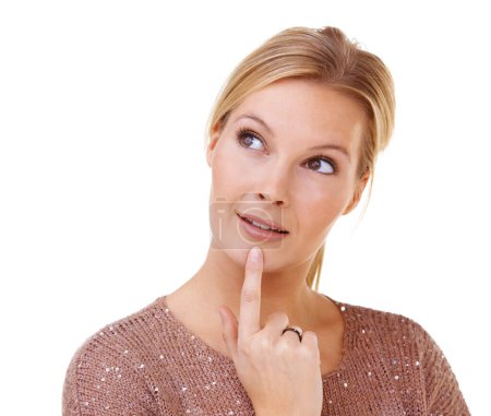 Photo for Considering her options. a pretty blonde with her finger on her chin - Royalty Free Image