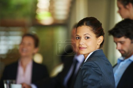Photo for Gaining corporate expertise everyday. A young businesswoman sitting in a corporate meeting - Royalty Free Image