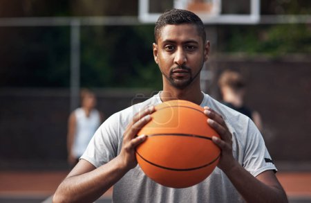 Photo for Its game time. Portrait of a sporty young man standing on a basketball court - Royalty Free Image