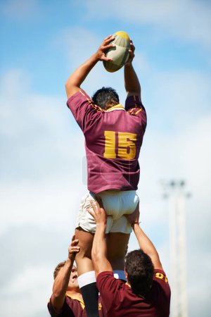 Photo for Rugby, ball and men with fitness, competition and training for wellness, exercise and teamwork. Professional players, group or male athletes with sports, match and practice with workout and challenge. - Royalty Free Image