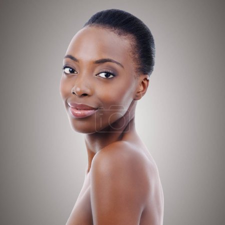Photo for Flawless Perfection. A gorgeous African woman smiling at the camera - isolated - Royalty Free Image