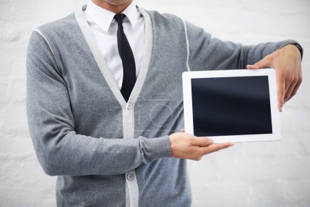 Advertise your product online. Cropped image of a nerd holding a digital tablet