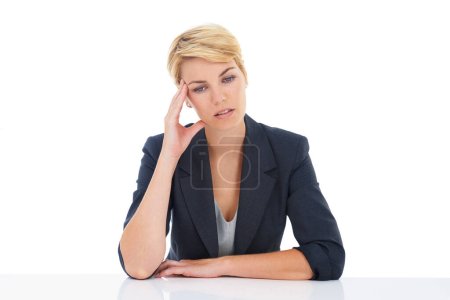 Photo for Too much work makes my head hurt. A young businesswoman suffering from a severe headache - Royalty Free Image
