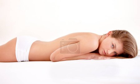 Photo for Sexy, underwear and portrait of woman in bed with confidence, seductive and sensual pose at home. Morning, lingerie and beautiful, gorgeous and attractive female person laying on white background. - Royalty Free Image