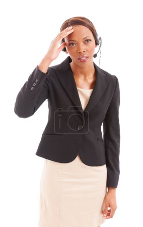 Photo for The stresses of my job. A stressed corporate woman on her headset - Royalty Free Image