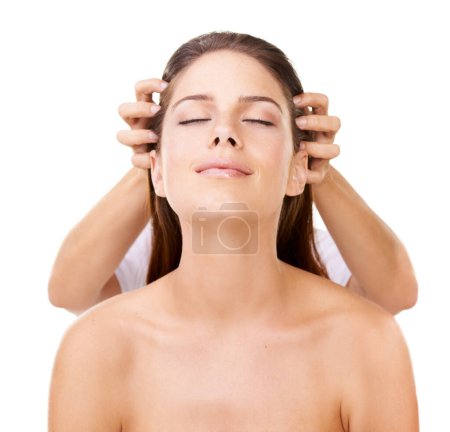 Photo for Enjoying that healing touch. Beautiful woman looking upwards while someone is giving her a head massage - Royalty Free Image